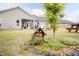 Well-maintained backyard with landscaping, small trees, and room for outdoor activities at 18 Fisher Rd, Lillington, NC 27546