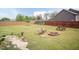 Large backyard with a fire pit, picnic table, and plenty of room to relax at 18 Fisher Rd, Lillington, NC 27546