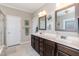 Bathroom with double sinks, large mirrors, and granite countertops at 18 Fisher Rd, Lillington, NC 27546