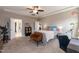 Spacious main bedroom with neutral walls, ceiling fan, and walk-in closet at 18 Fisher Rd, Lillington, NC 27546