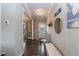 Bright entryway features neutral walls, a decorative mirror, and a bench for added comfort at 18 Fisher Rd, Lillington, NC 27546