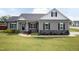 Charming single-story home boasts a manicured lawn and inviting covered porch at 18 Fisher Rd, Lillington, NC 27546