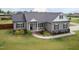 Beautiful single-story home featuring manicured landscaping and a welcoming covered porch at 18 Fisher Rd, Lillington, NC 27546