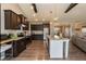 Stylish kitchen with a large island, wooden floors, stainless appliances, and an open concept layout at 18 Fisher Rd, Lillington, NC 27546