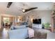 Spacious living room featuring a large sectional sofa and views into the kitchen and dining areas at 18 Fisher Rd, Lillington, NC 27546