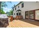 Expansive wooden deck perfect for outdoor entertaining, featuring access to the home and backyard at 1816 Albacore Ln, Raleigh, NC 27612
