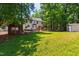 Sprawling backyard showcasing a gazebo, shed, mature trees, and a lush green lawn at 1816 Albacore Ln, Raleigh, NC 27612