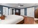 This bedroom features hardwood flooring, white trim, neutral paint, and ensuite bathroom at 1816 Albacore Ln, Raleigh, NC 27612