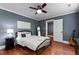 Bedroom featuring hardwood floors, neutral paint, and ceiling fan at 1816 Albacore Ln, Raleigh, NC 27612