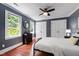 Bedroom featuring hardwood floors, neutral paint, ceiling fan, and double closets at 1816 Albacore Ln, Raleigh, NC 27612