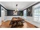 Inviting dining room featuring a wooden table, comfortable bench seating, and natural light at 1816 Albacore Ln, Raleigh, NC 27612