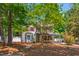 Charming two-story home with mature trees and a well-manicured lawn at 1816 Albacore Ln, Raleigh, NC 27612