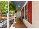 Inviting front porch featuring red brick flooring, decorative columns, and ample space for seating at 1816 Albacore Ln, Raleigh, NC 27612