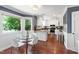 Bright kitchen with white cabinets, stainless steel appliances, and an eat-in area at 1816 Albacore Ln, Raleigh, NC 27612