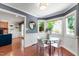 Cozy breakfast nook featuring a round glass table and views of the backyard at 1816 Albacore Ln, Raleigh, NC 27612