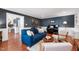 Comfortable living room with blue sofa, piano, and stylish decor at 1816 Albacore Ln, Raleigh, NC 27612