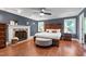 Spacious main bedroom with a fireplace, ceiling fan, and a king bed at 1816 Albacore Ln, Raleigh, NC 27612