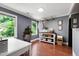 Bright, naturally lit office features hardwood floors, built-ins, and drying rack at 1816 Albacore Ln, Raleigh, NC 27612