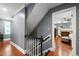 View of a staircase landing with wood floors and view into a bedroom at 1816 Albacore Ln, Raleigh, NC 27612