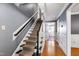 Carpeted staircase with gray walls and white trim, leading to the upper level at 1816 Albacore Ln, Raleigh, NC 27612