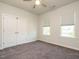 Bedroom with double doors to closet, two windows and neutral carpet at 1941 Bright Kannon Way, Wendell, NC 27591