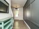 Welcoming foyer with hardwood floors and modern paneling, leading to the staircase and other living spaces at 1941 Bright Kannon Way, Wendell, NC 27591