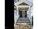 Inviting covered front porch with stone steps and plenty of room to relax at 1941 Bright Kannon Way, Wendell, NC 27591