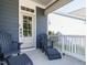 Cozy covered front porch with comfortable chairs, perfect for enjoying the outdoors at 1941 Bright Kannon Way, Wendell, NC 27591