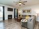 Comfortable living room with a fireplace, ample seating, and a ceiling fan for added comfort at 1941 Bright Kannon Way, Wendell, NC 27591