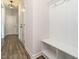 Mud room with white bench and coat hooks near the main entry way at 1941 Bright Kannon Way, Wendell, NC 27591