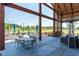 Outdoor patio area with tables, chairs, and comfortable seating, ideal for relaxation and socializing at 1941 Bright Kannon Way, Wendell, NC 27591
