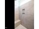 Luxury tile shower featuring built-in bench seating, niche, and modern fixture offering a spa-like experience at 1941 Bright Kannon Way, Wendell, NC 27591