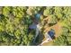 A beautiful home with a pool is nestled in a forest of trees at 205 Smiths Creek Dr, Clayton, NC 27520