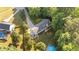 Aerial view of a home with a large yard and a patio area at 205 Smiths Creek Dr, Clayton, NC 27520