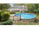 Inviting backyard with an above-ground pool and wooden deck, perfect for outdoor enjoyment at 205 Smiths Creek Dr, Clayton, NC 27520