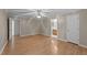 This bedroom features a ceiling fan, wood flooring, and an ensuite bathroom at 205 Smiths Creek Dr, Clayton, NC 27520