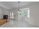 Bright dining area featuring bay window and views of outdoors, and adjacent fireplace at 205 Smiths Creek Dr, Clayton, NC 27520