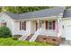 Home with red shutters and a quaint front porch at 205 Smiths Creek Dr, Clayton, NC 27520
