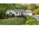 Charming single Gathering home featuring a manicured lawn and a 2-car attached garage at 205 Smiths Creek Dr, Clayton, NC 27520