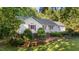 Well-kept home with a lush lawn and decorative red shutters at 205 Smiths Creek Dr, Clayton, NC 27520