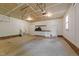 Spacious garage featuring ample storage with built-in cabinets and shelving at 205 Smiths Creek Dr, Clayton, NC 27520