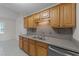 Kitchen featuring stainless steel appliances, wood cabinetry, and a view to the dining area at 205 Smiths Creek Dr, Clayton, NC 27520
