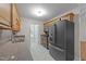 Kitchen showcasing modern stainless appliances, ample countertop space, and wood cabinets at 205 Smiths Creek Dr, Clayton, NC 27520