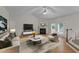 Bright living room with fireplace and French doors to deck at 205 Smiths Creek Dr, Clayton, NC 27520