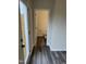 A view into the bathroom with a toilet, hardwood floors, and modern fixtures at 2118 Terrawood Dr, Durham, NC 27703