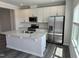 Modern kitchen featuring stainless steel appliances, a center island, and white cabinets at 2118 Terrawood Dr, Durham, NC 27703