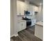 Gourmet kitchen featuring stainless steel appliances, stylish cabinets, and granite countertops at 2118 Terrawood Dr, Durham, NC 27703