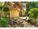 Backyard showcasing a wooden deck, bench, and mature trees, creating a serene and inviting outdoor space at 2143 Ridge Rd, Raleigh, NC 27607