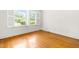 Bedroom with bright natural light and hardwood floors at 2143 Ridge Rd, Raleigh, NC 27607