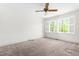 Bedroom with natural light and neutral carpet at 2143 Ridge Rd, Raleigh, NC 27607